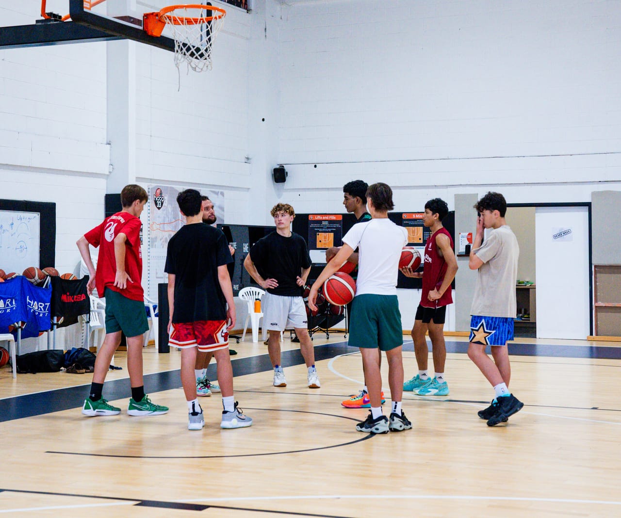 A group of young Hoop33 Academy players on the court during a session