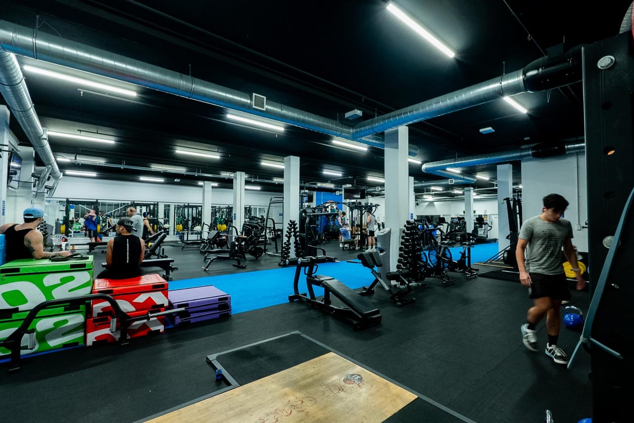 The Hoop33 24/7 gym floor with members training across the facility