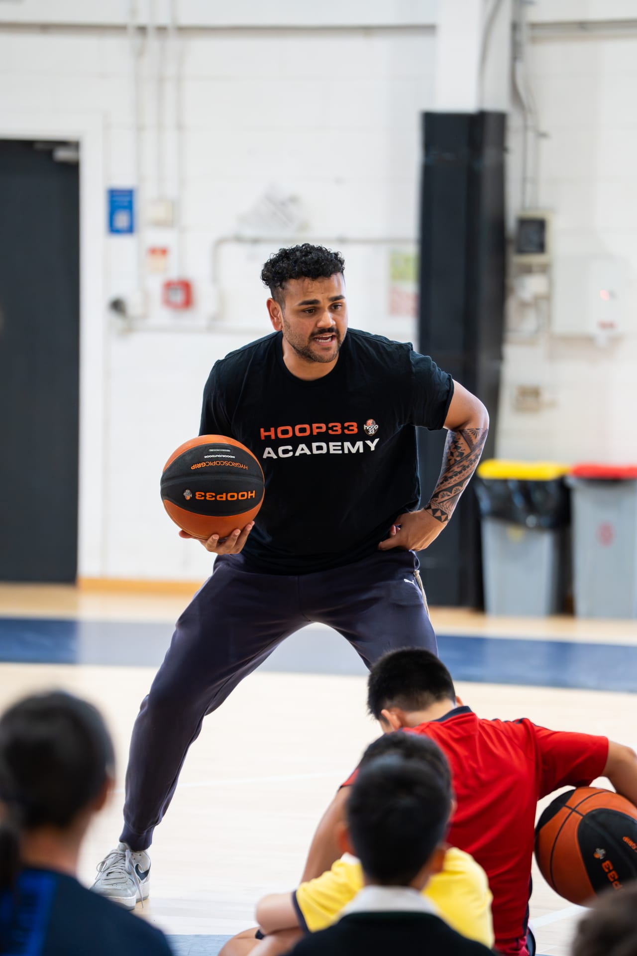 A Hoop33 Academy coach demonstrating with the ball