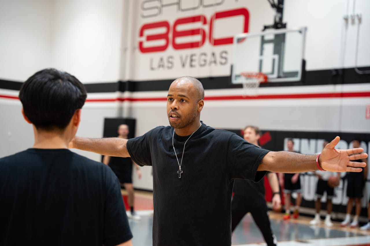 A Hoop33 coach directing a player on court during the USA Tour