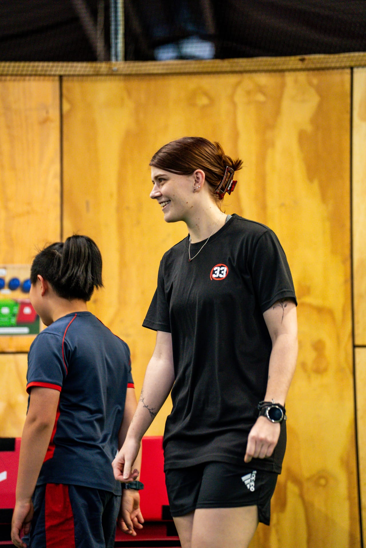 Sarah Traill coaching a young athlete