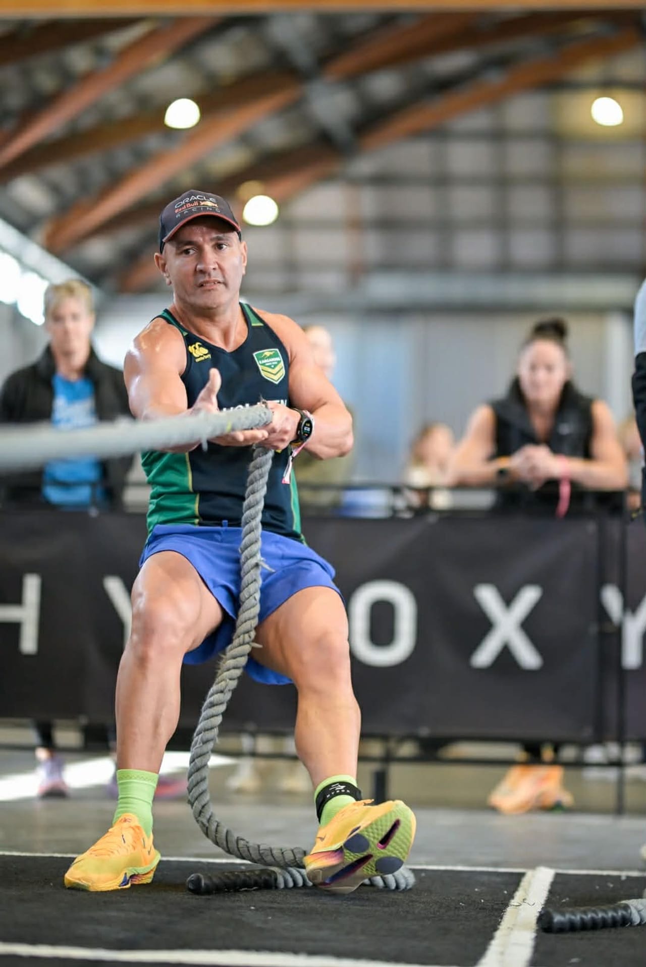 Hoop33 member Aeneas hauling on the rope pull at a HYROX race