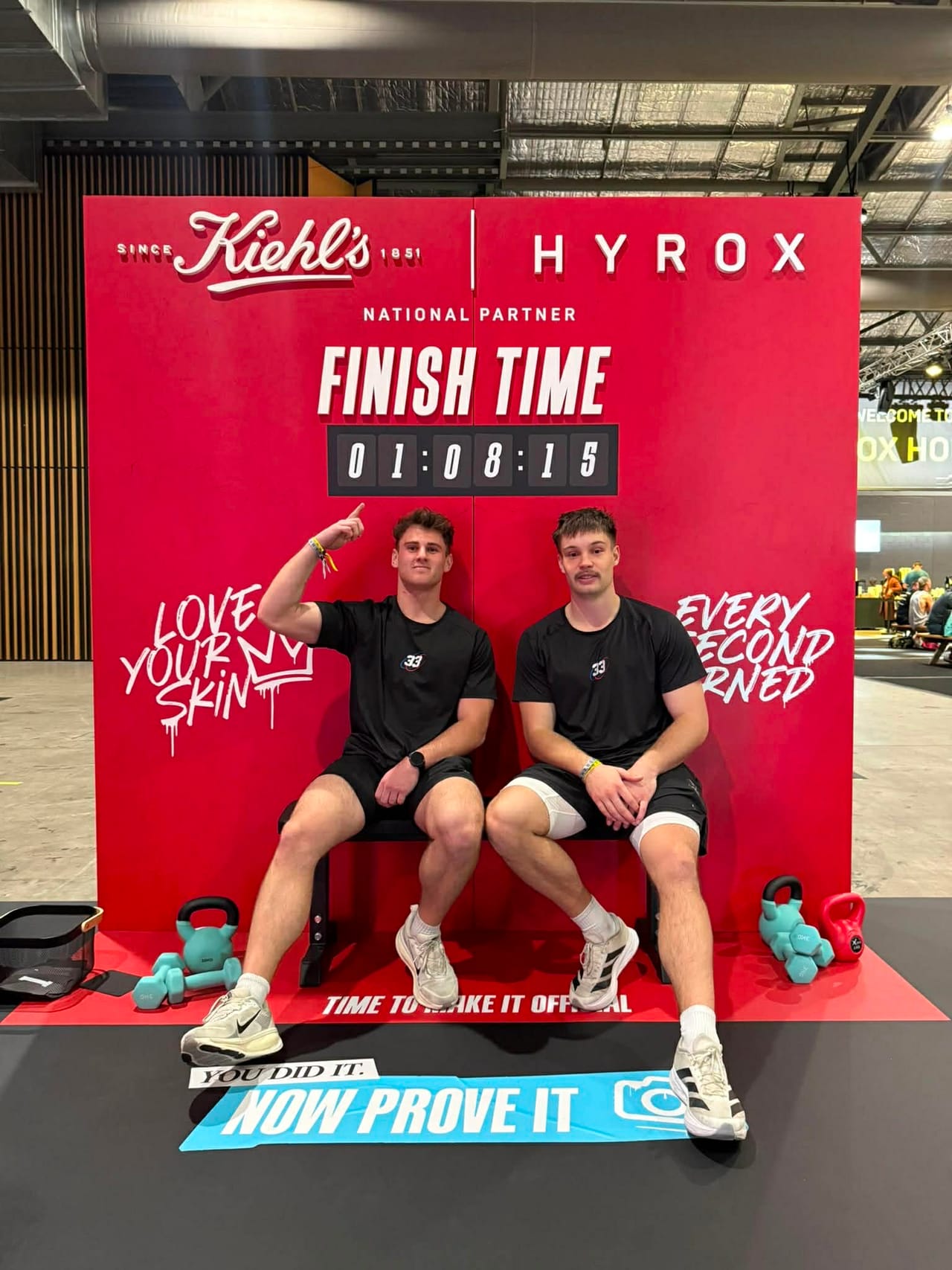 Hoop33 members Jay and Reuben at the HYROX finish board after their race