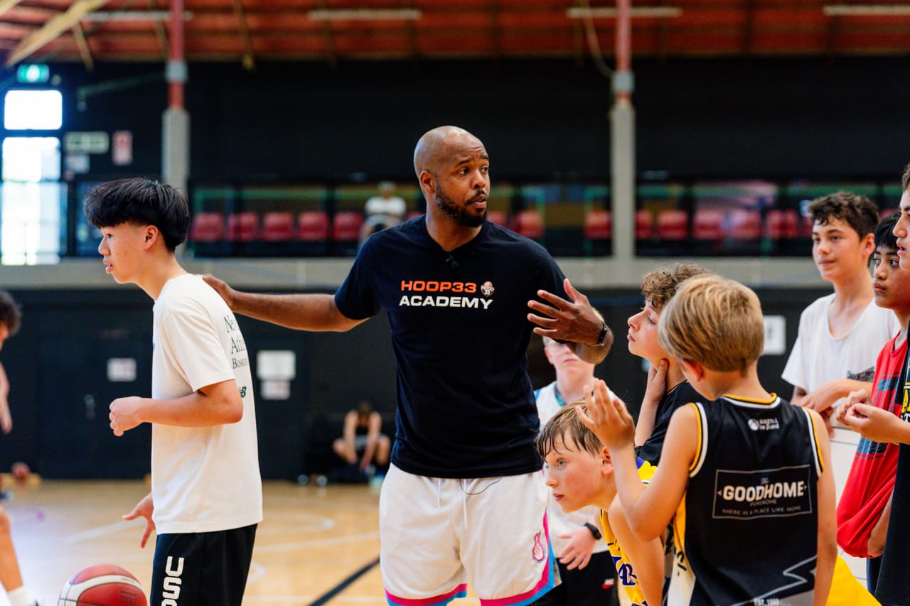 Hoop33 Basketball Director Carl Buck coaching on court